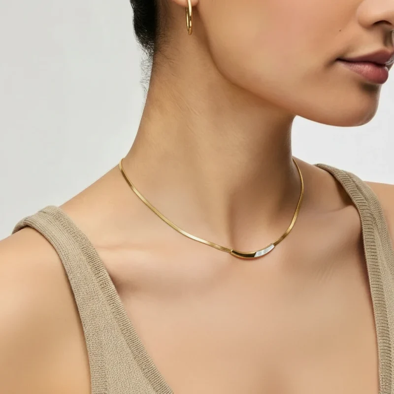 Pearl Arc Necklace details - close-up of elegant gold chain and pendant