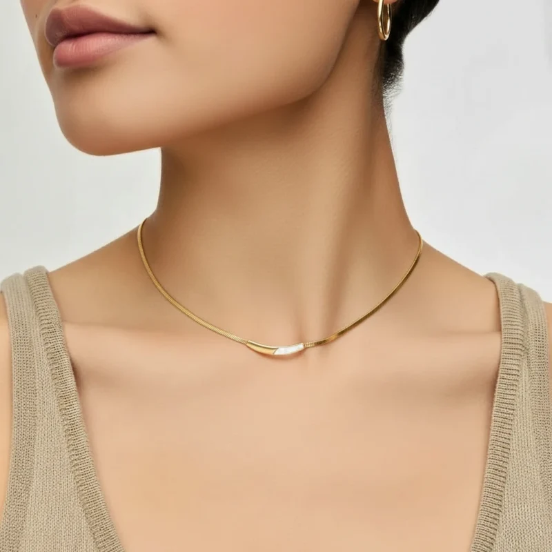 Model wearing Pearl Arc Necklace - elegant gold necklace on woman